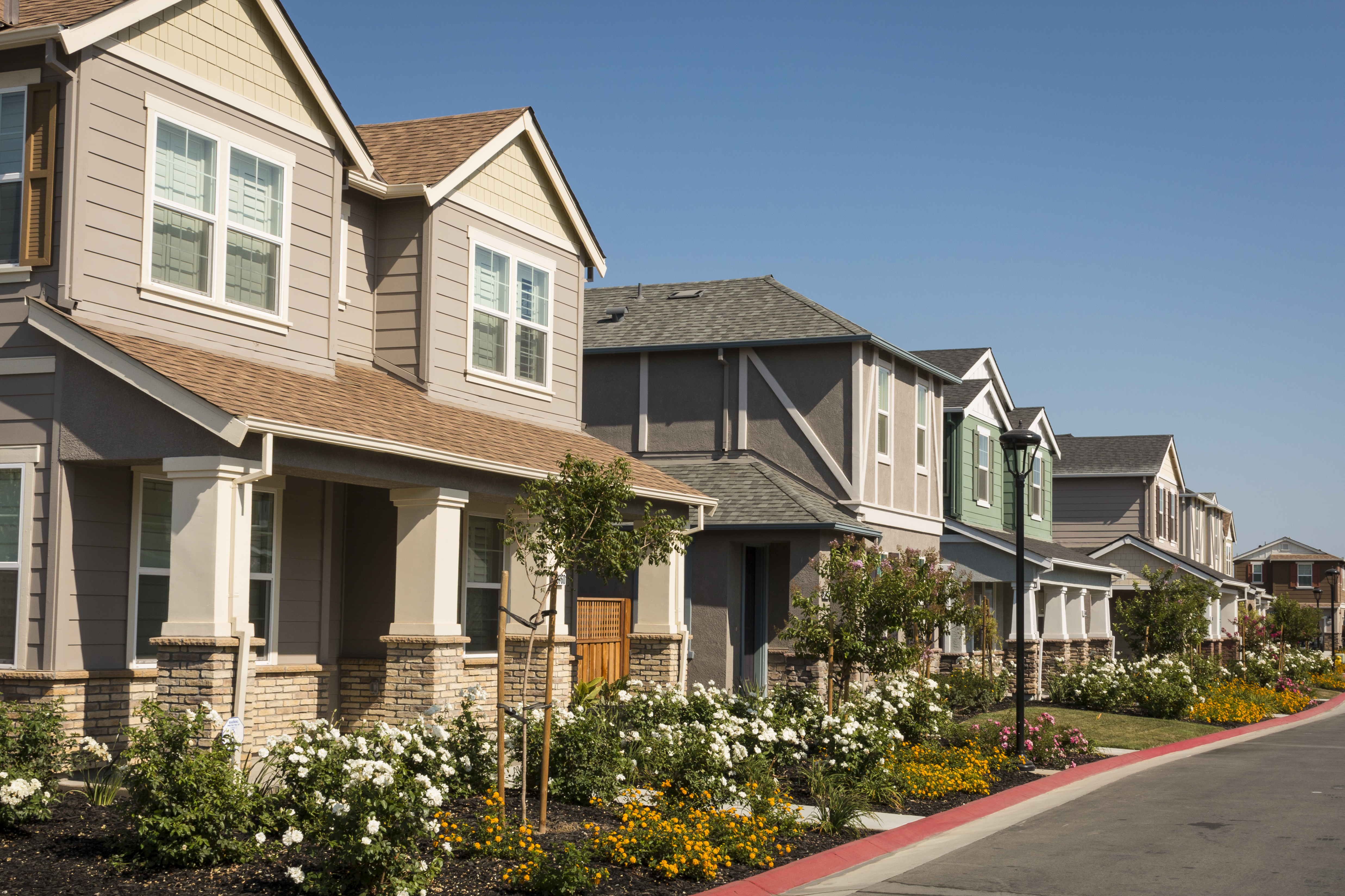A row of newly-built houses in a residential subdivision.